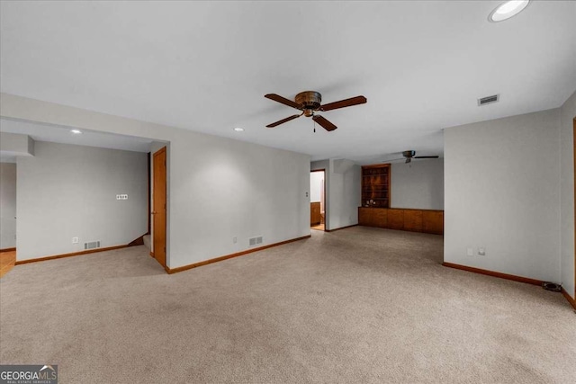 unfurnished living room featuring ceiling fan, carpet, baseboards, and recessed lighting