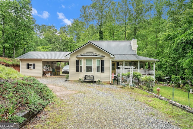 375 Buckwood Trl, Cornelia, GA 30531 - view of front of property with gravel driveway, a chimney, and metal roof