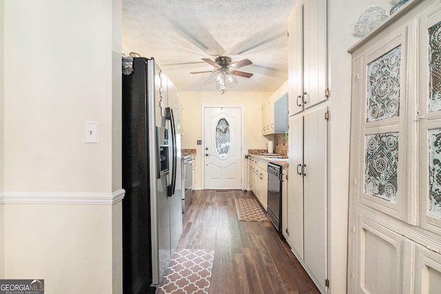 375 Buckwood Trl, Cornelia, GA 30531 - kitchen featuring dishwasher, stainless steel fridge, a ceiling fan, dark wood finished floors, and range