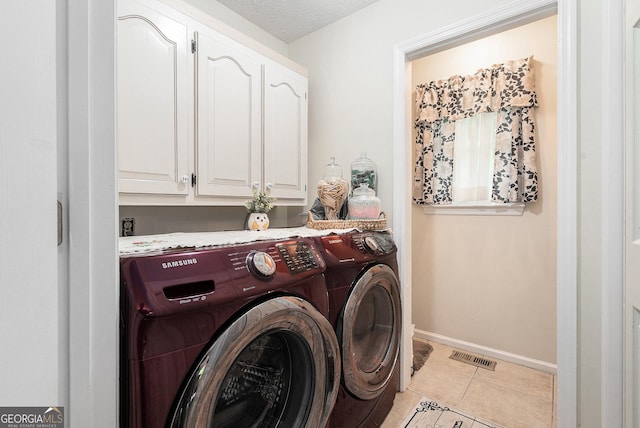 375 Buckwood Trl, Cornelia, GA 30531 - washroom featuring cabinet space, washing machine and clothes dryer, light tile patterned flooring, and baseboards