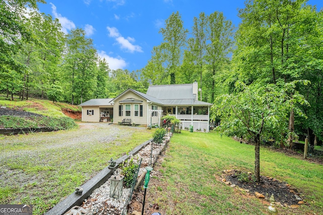 375 Buckwood Trl, Cornelia, GA 30531 - back of house with a chimney, a lawn, and metal roof