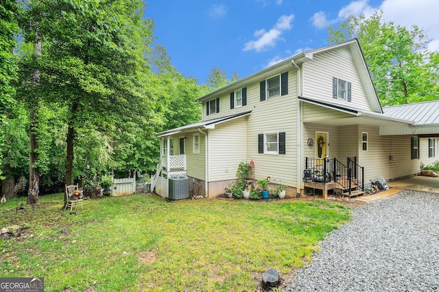 375 Buckwood Trl, Cornelia, GA 30531 - view of property exterior with central air condition unit, a carport, and a yard