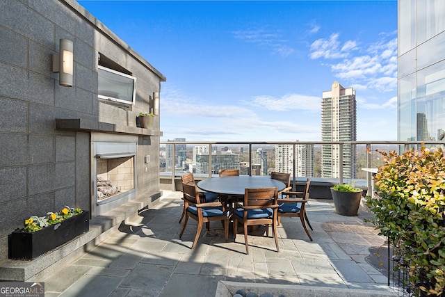3630 Peachtree Rd NE Unit 1909, Atlanta, GA 30326 - balcony featuring a city view and outdoor dining area