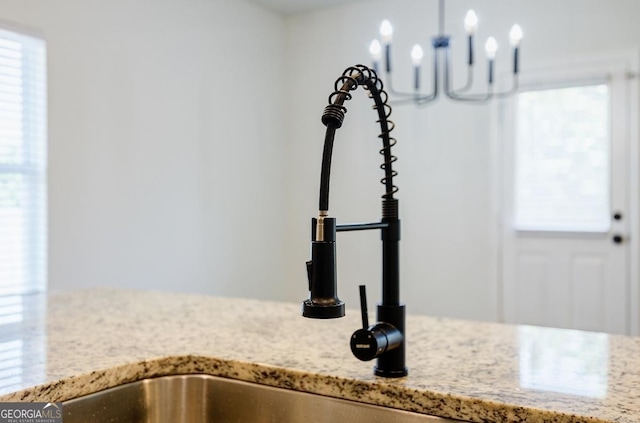 180 Oliver Dr, Locust Grove, GA 30248 - kitchen view of a sink and light stone countertops