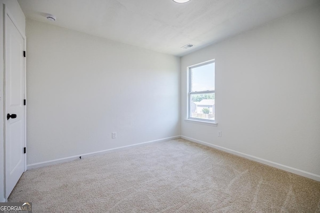 180 Oliver Dr, Locust Grove, GA 30248 - empty room featuring carpet floors and baseboards