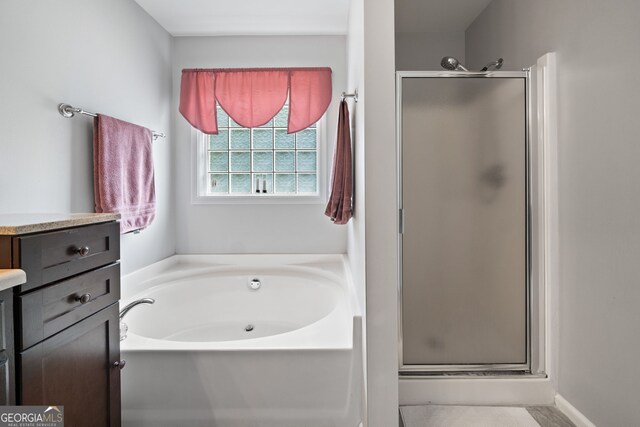 59 Kaiser Ct, Dallas, GA 30132 - bathroom featuring vanity, a shower stall, and a garden tub