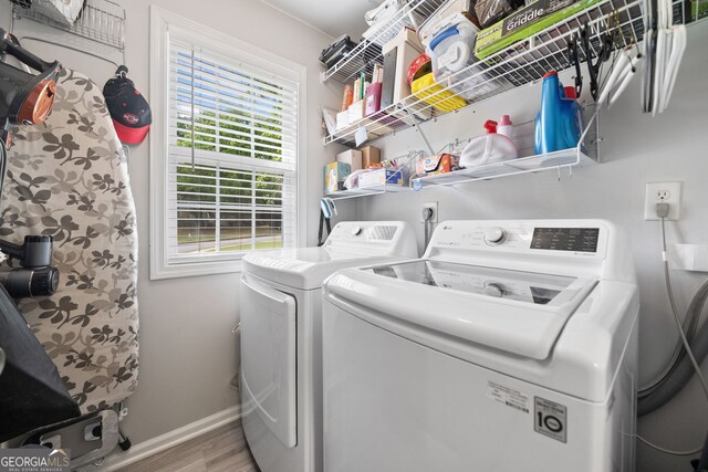 59 Kaiser Ct, Dallas, GA 30132 - laundry room featuring separate washer and dryer, wood finished floors, and baseboards