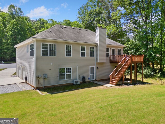 59 Kaiser Ct, Dallas, GA 30132 - rear view of property featuring a deck, stairway, a chimney, and a lawn