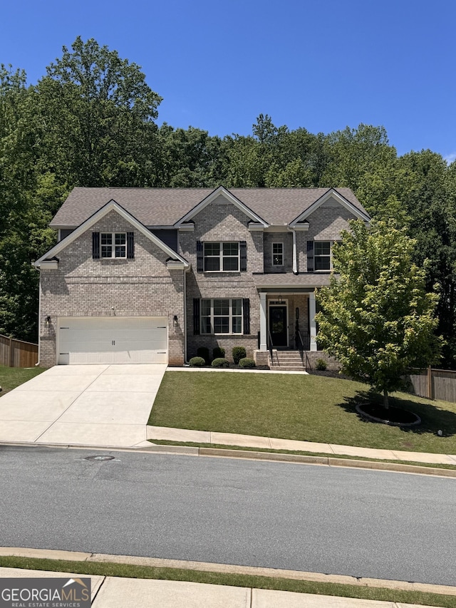 4736 Landing Water Path, Buford, GA 30519 - view of front of property featuring concrete driveway, brick siding, and an attached garage