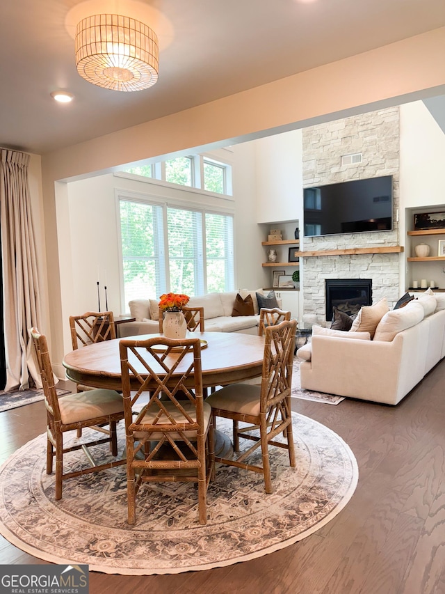 4736 Landing Water Path, Buford, GA 30519 - dining area featuring wood finished floors, a fireplace, and recessed lighting