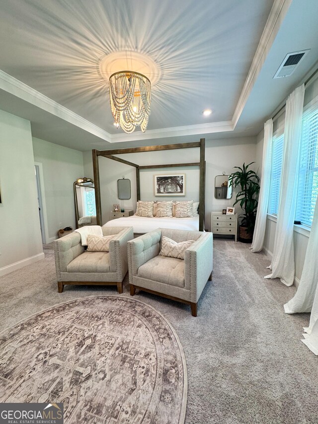 4736 Landing Water Path, Buford, GA 30519 - carpeted bedroom featuring a tray ceiling, ornamental molding, baseboards, and a chandelier