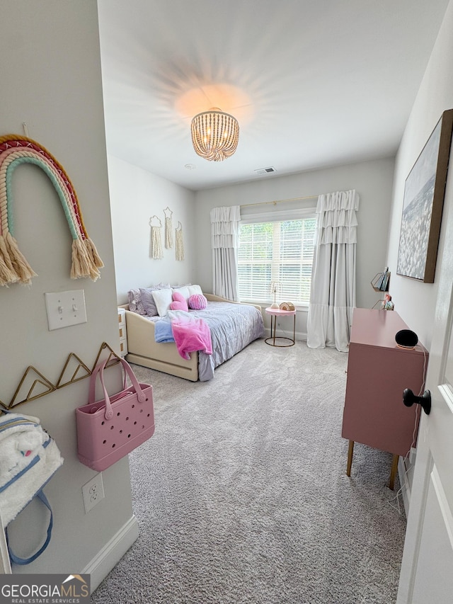 4736 Landing Water Path, Buford, GA 30519 - bedroom featuring carpet floors and a chandelier