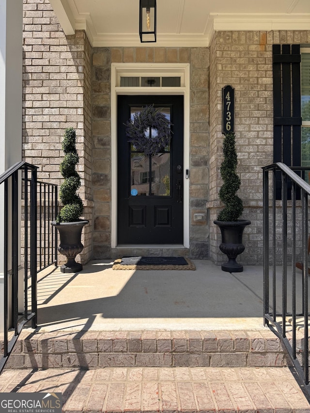 4736 Landing Water Path, Buford, GA 30519 - view of exterior entry with covered porch and stone siding
