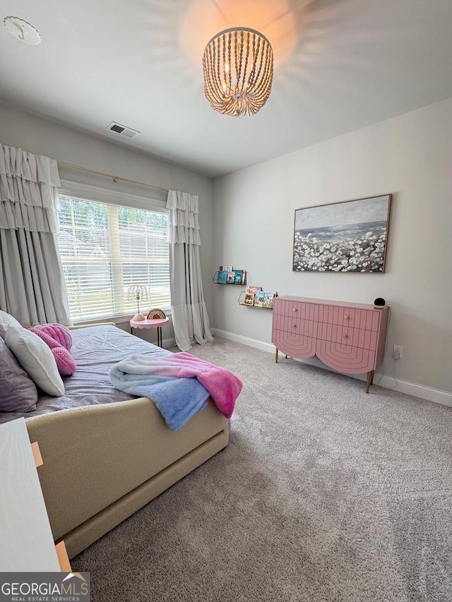4736 Landing Water Path, Buford, GA 30519 - carpeted bedroom featuring baseboards and a chandelier
