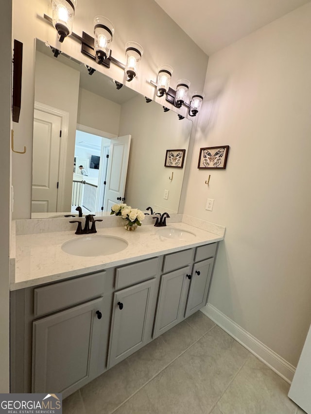 4736 Landing Water Path, Buford, GA 30519 - full bathroom with double vanity, baseboards, and tile patterned flooring
