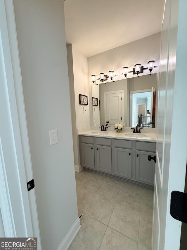 4736 Landing Water Path, Buford, GA 30519 - bathroom with tile patterned flooring, double vanity, and baseboards