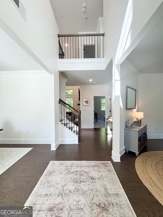 4736 Landing Water Path, Buford, GA 30519 - foyer entrance featuring stairway, wood finished floors, baseboards, a towering ceiling, and ornamental molding