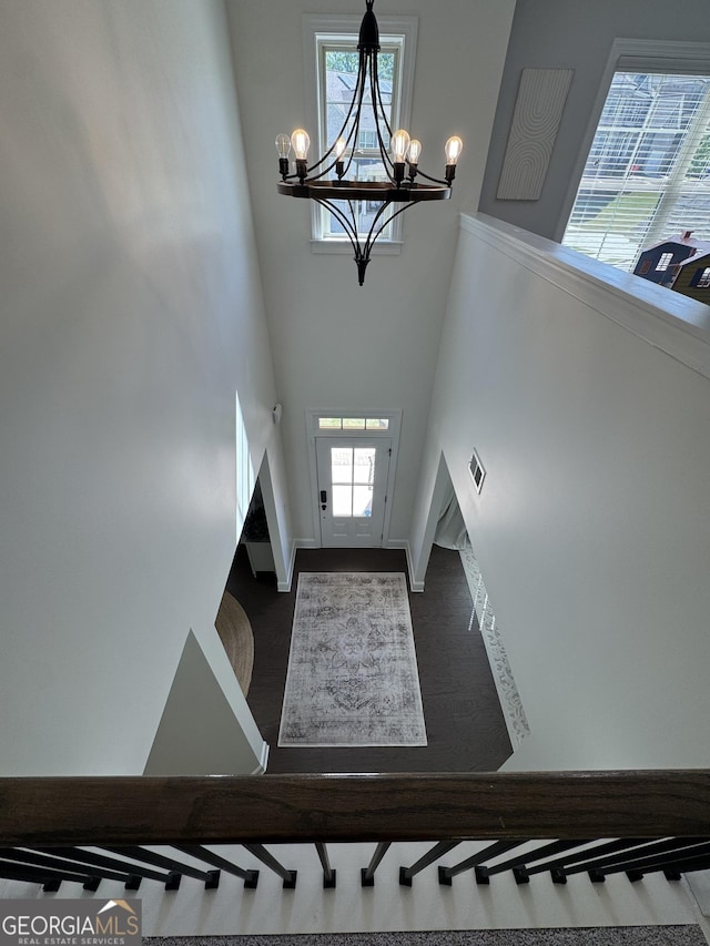 4736 Landing Water Path, Buford, GA 30519 - entrance foyer featuring a chandelier, a high ceiling, and baseboards