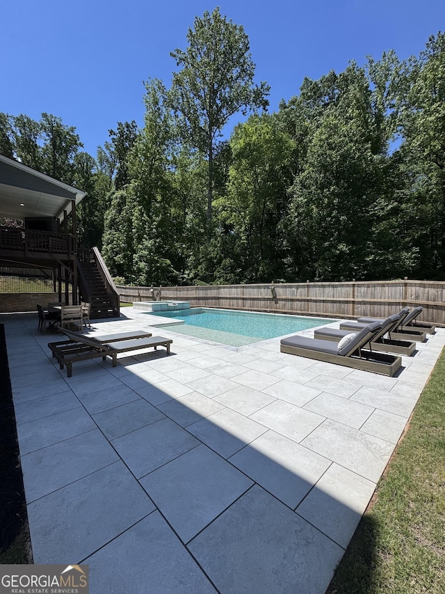 4736 Landing Water Path, Buford, GA 30519 - view of swimming pool with a patio area, stairway, fence, and a pool with connected hot tub