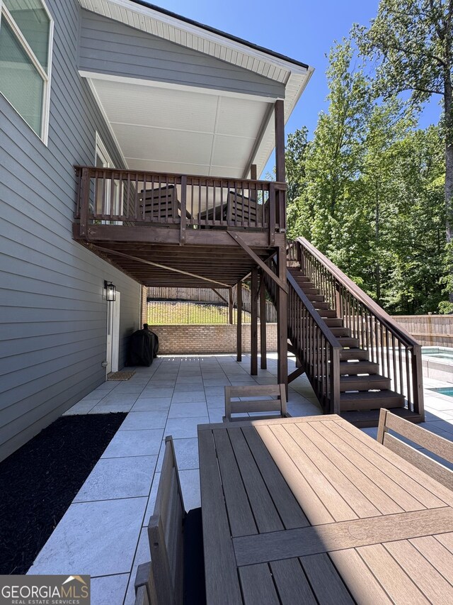 4736 Landing Water Path, Buford, GA 30519 - wooden deck with stairs, a patio, and fence