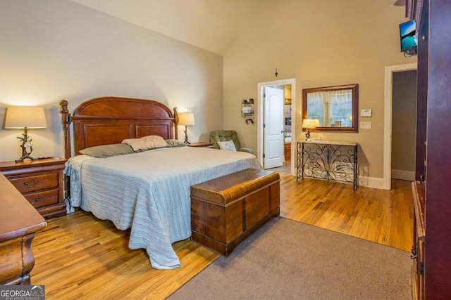 87 Marcus Ct, Ball Ground, GA 30107 - bedroom with wood finished floors and high vaulted ceiling