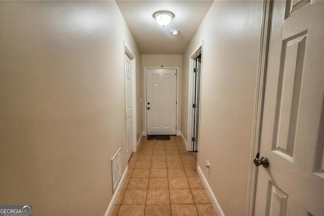 87 Marcus Ct, Ball Ground, GA 30107 - hallway with light tile patterned floors and baseboards