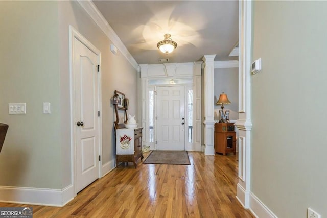 87 Marcus Ct, Ball Ground, GA 30107 - entryway with light wood-style floors and ornamental molding