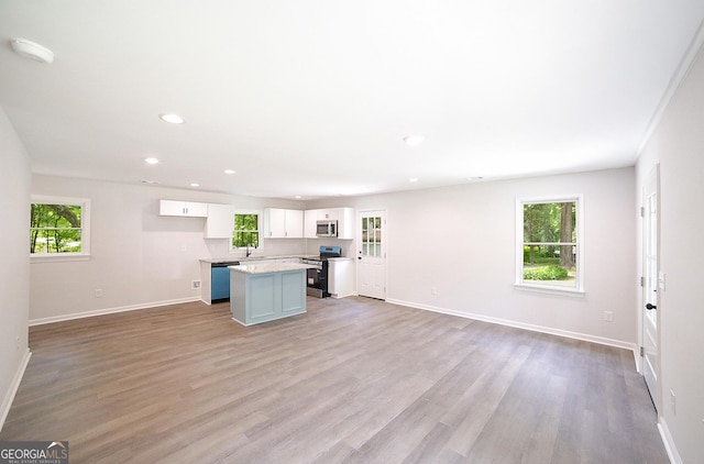 165 Dowdy Rd, Athens, GA 30606 - kitchen featuring appliances with stainless steel finishes, white cabinets, a kitchen island, baseboards, and recessed lighting