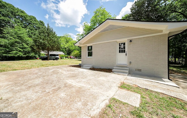 165 Dowdy Rd, Athens, GA 30606 - rear view of house with entry steps, brick siding, a lawn, and a patio area