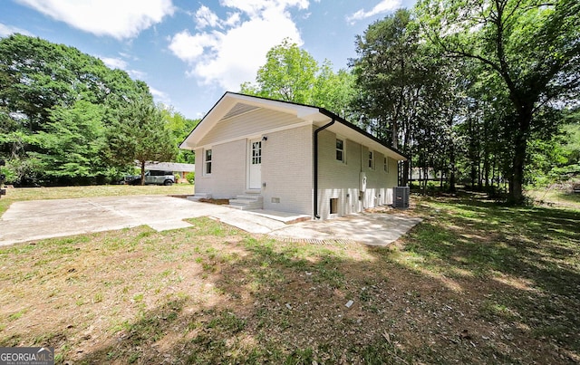 165 Dowdy Rd, Athens, GA 30606 - view of side of property with brick siding, entry steps, central air condition unit, and a patio area