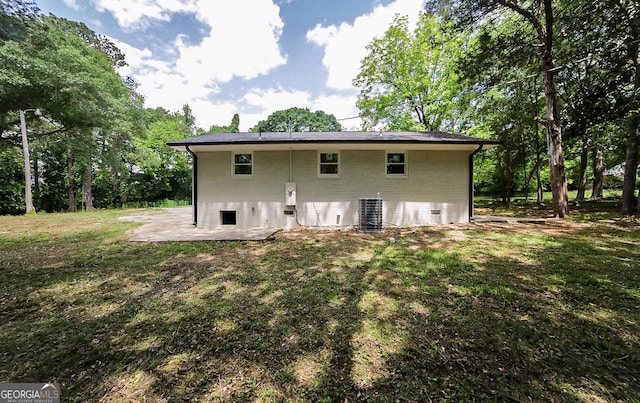 165 Dowdy Rd, Athens, GA 30606 - rear view of house featuring a patio area, brick siding, a lawn, and central air condition unit