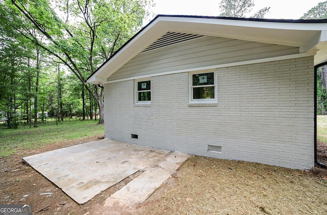 165 Dowdy Rd, Athens, GA 30606 - view of home's exterior with crawl space, a patio area, and brick siding