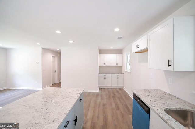 165 Dowdy Rd, Athens, GA 30606 - kitchen featuring dishwashing machine, light wood-type flooring, light stone countertops, white cabinets, and recessed lighting