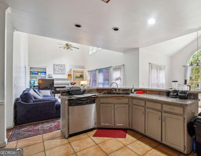 kitchen featuring dishwasher, open floor plan, a sink, light tile patterned flooring, and a ceiling fan