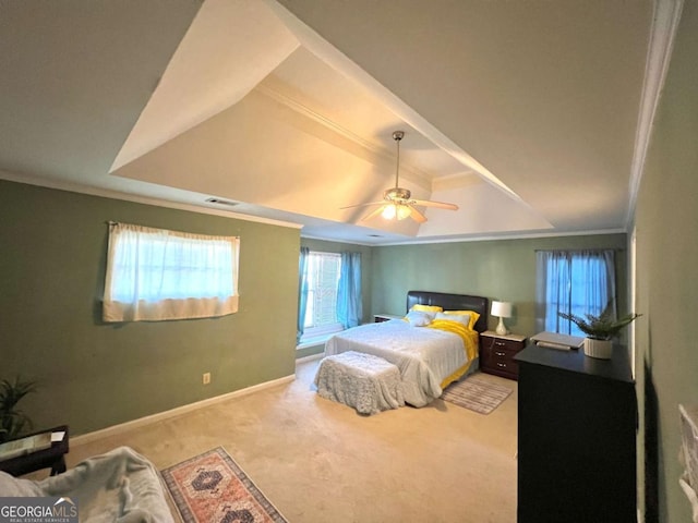 carpeted bedroom featuring ornamental molding, baseboards, and ceiling fan