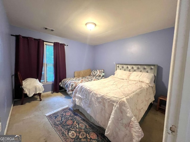 carpeted bedroom with baseboards