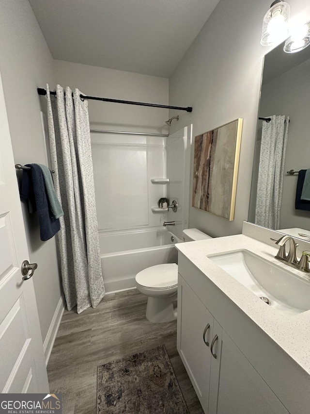3006 Fairway Dr, Villa Rica, GA 30180 - full bath with vanity, shower / bath combination with curtain, and wood finished floors