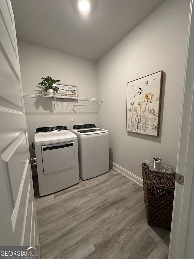 3006 Fairway Dr, Villa Rica, GA 30180 - laundry room featuring separate washer and dryer and wood finished floors