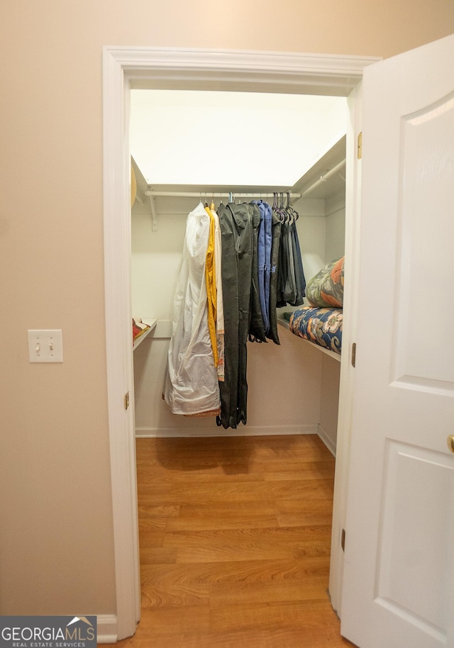 walk in closet featuring light wood-style floors