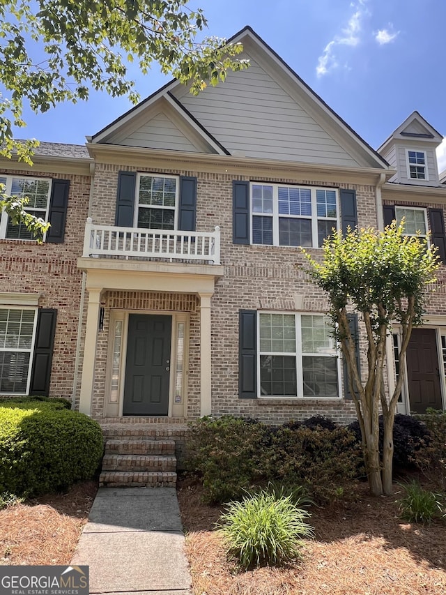 4540 Cold Spring Ct, Cumming, GA 30041 - georgian-style home with brick siding and a balcony