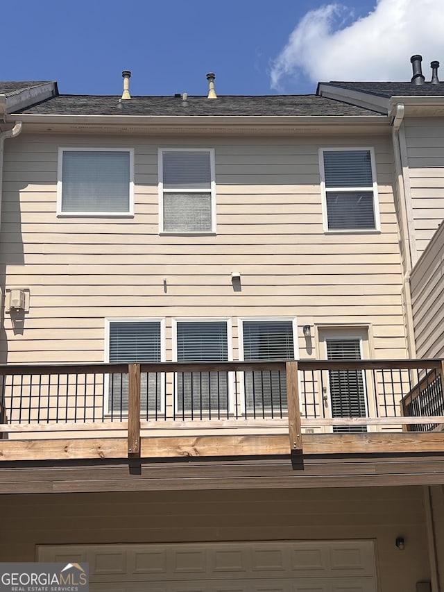 4540 Cold Spring Ct, Cumming, GA 30041 - back of property with a balcony and an attached garage