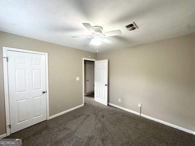 6309 Wellington Way, Austell, GA 30106 - unfurnished bedroom with carpet, baseboards, and a ceiling fan