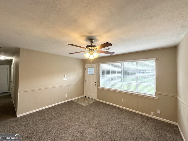 6309 Wellington Way, Austell, GA 30106 - entrance foyer with a ceiling fan, dark colored carpet, and a textured ceiling