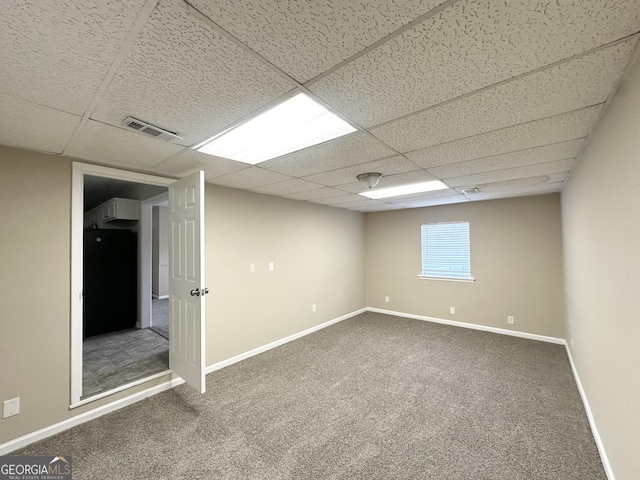 6309 Wellington Way, Austell, GA 30106 - below grade area featuring a paneled ceiling, carpet, baseboards, and refrigerator