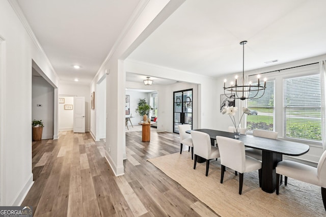 3991 Perry Pass, Lithonia, GA 30038 - dining room featuring a chandelier, ornamental molding, light wood-style flooring, baseboards, and recessed lighting