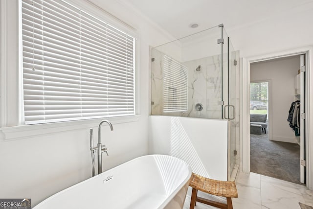 3991 Perry Pass, Lithonia, GA 30038 - bathroom with a freestanding bath, a stall shower, and marble look tiles