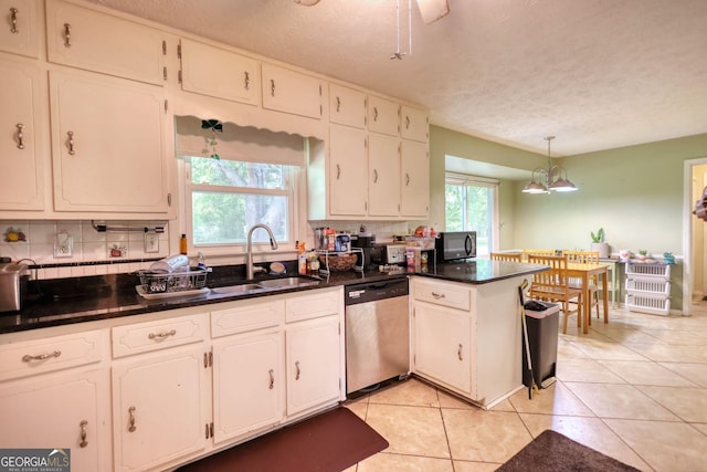 2368 Ellis Ct, Snellville, GA 30078 - kitchen featuring stainless steel dishwasher, black microwave, white cabinetry, a textured ceiling, and backsplash