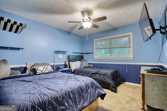 2368 Ellis Ct, Snellville, GA 30078 - bedroom with carpet floors, a textured ceiling, and a ceiling fan