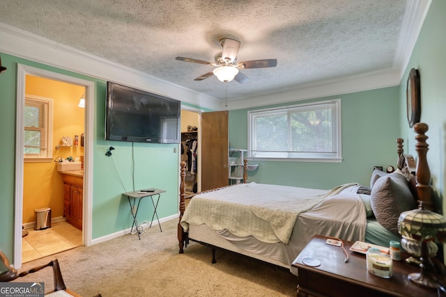 2368 Ellis Ct, Snellville, GA 30078 - bedroom featuring ornamental molding, a textured ceiling, a walk in closet, ensuite bath, and a closet