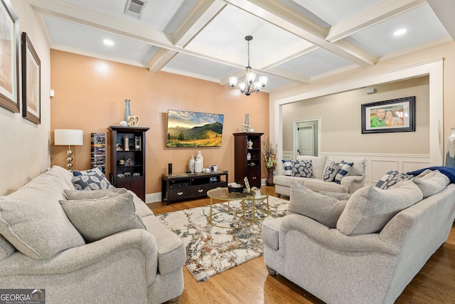 11 Main St, Newnan, GA 30263 - living room with beamed ceiling, a chandelier, wood finished floors, coffered ceiling, and ornamental molding